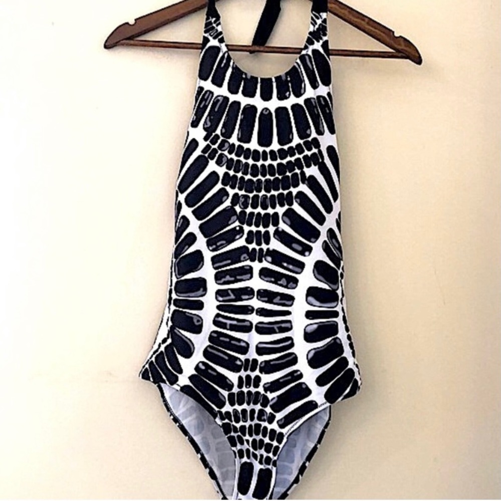 Black & white contemporary pattern one piece swimsuit. Ties at neck. Back straps